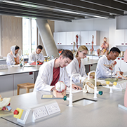 Multiple undergraduate students learning in a classroom