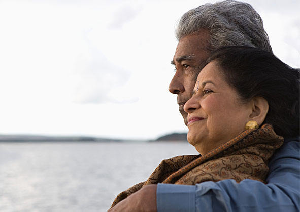 Elder couple looking out into the water